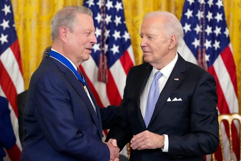 President Joe Biden awards the nation's highest civilian honor, the Presidential Medal of Freedom, to former Vice President Al Gore during a ceremony in the East Room of the White House, Friday, May 3, 2024, in Washington. (AP Photo/Alex Brandon)