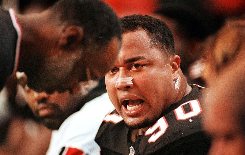 Atlanta Falcons defensive end Chuck Smith vents his frustration by yelling at teammates and team personnel during a loss in 1996. Smith had nearly 60 sacks in his time in Atlanta. (Curtis Compton/AJC)