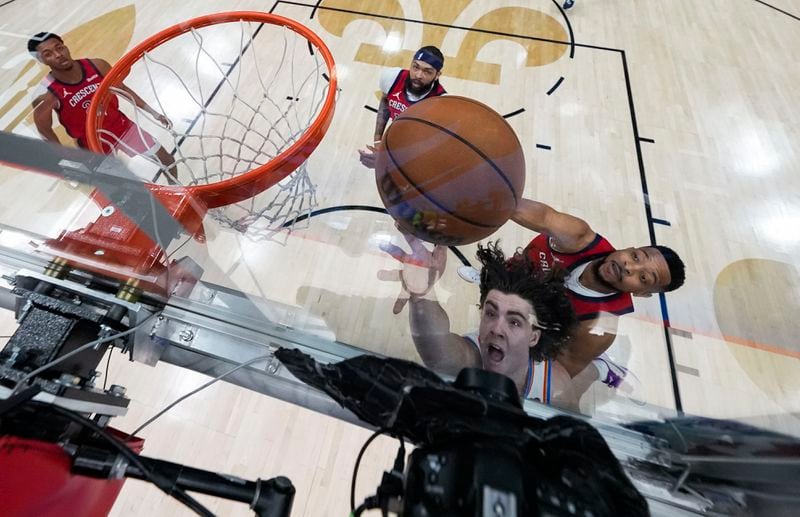 Oklahoma City Thunder guard Josh Giddey goes to the basket against New Orleans Pelicans guard CJ McCollum in the first half of Game 3 of an NBA basketball first-round playoff series in New Orleans, Saturday, April 27, 2024. (AP Photo/Gerald Herbert)