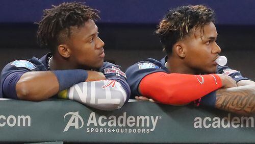 Ronald Acuna (left, with prospect Cristian Pache) could join the Braves outfield as soon as mid-April, and some believe he’s a generational-type talent whose rookie season will be one to remember.   Curtis Compton/ccompton@ajc.com