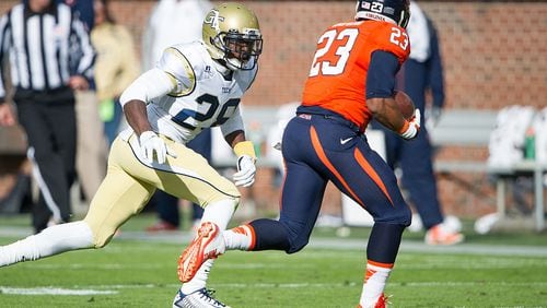 ATLANTA, GA - NOVEMBER 1: Defensive back D.J. White #28 of the Georgia Tech Yellow Jackets looks to tackle running back Khalek Shepherd #23 of the Virginia Cavaliers on November 1, 2014 at Bobby Dodd Stadium in Atlanta, Georgia. At halftime the Georgia Tech Yellow Jackets leads the Virginia Cavaliers - . (Photo by Michael Chang/Getty Images)