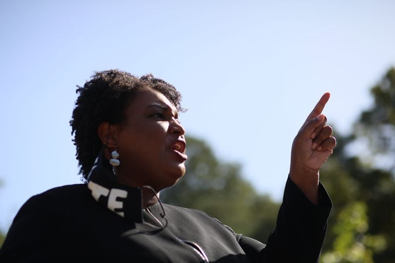 Former Georgia Minority Leader Stacey Abrams speaks to dozens of Raphael Warnock supporters during Election Day 2020. 
Miguel Martinez for The Atlanta Journal-Constitution