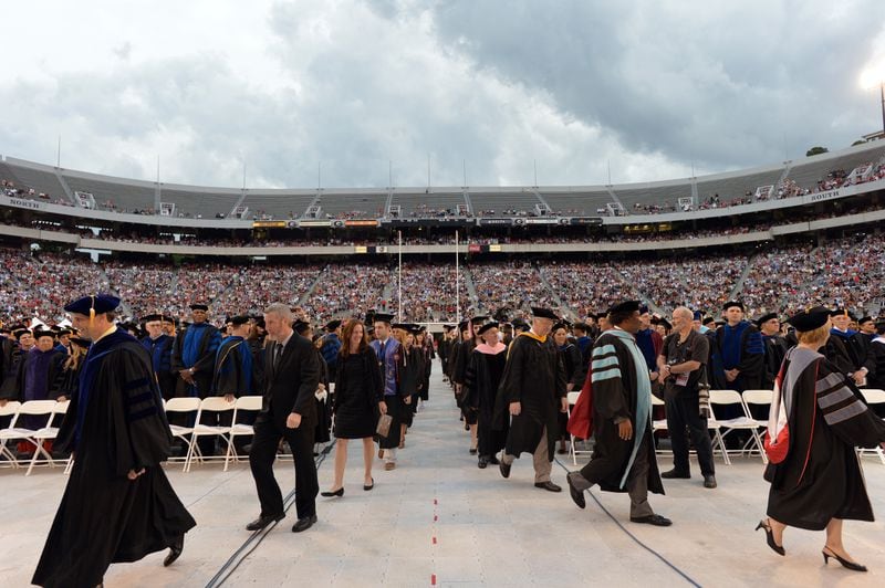 University of Georgia faculty members march during the procession to start the 2014 spring undergraduate commencement at Sanford Stadium in Athens. (Hyosub Shin / AJC file photo)