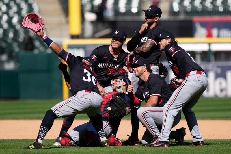 Minnesota Twins players celebrate after the Twins defeated the Chicago White Sox 10-5 in a baseball game in Chicago, Wednesday, May 1, 2024. (AP Photo/Nam Y. Huh)