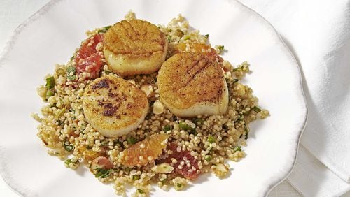 Saturday’s Quinoa Pilaf With Seared Scallops are served with sugar snap peas and baguettes. Contributed by EatingWell