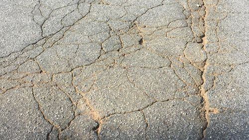 A reader wants something done about the aging roads in his Roswell subdivision. Photo/Submitted.