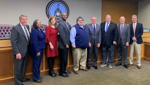 Lawrenceville City Council members present the “Distinguished Budget Presentation Award” to representatives from the Finance and Communications Departments. L-R: Councilman Keith Roche, Councilwoman Victoria Jones, Melissa Hardegree, Manager of Marketing & Tourism; Derrick Turner, Budget Analyst; Keith Lee, Director of Finance; Mayor David Still; Councilman Bob Clark, Councilman Glenn Martin, and Chuck Warbington, City Manager. (Courtesy City of Lawrenceville)