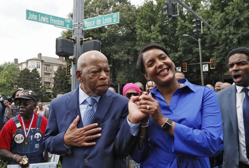 8/22/18 - Atlanta - U.S. Rep. John Lewis and Mayor Keisha Lance Bottoms celebrate together after Freedom Parkway was renamed “John Lewis Freedom Parkway” during a dedication ceremony and sign unveiling and the Freedom Riders play space was dedicated. BOB ANDRES /BANDRES@AJC.COM