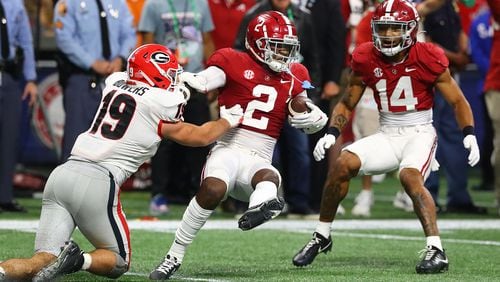 Alabama defensive back DeMarcco Hellams intercepts a Stetson Bennett pass intended for tight end Brock Bowers in the SEC Championship game on Saturday, Dec 4, 2021, in Atlanta.  (Curtis Compton / AJC file)