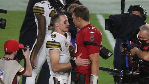 New Orleans Saints quarterback Drew Brees (9) talks with Tampa Bay Buccaneers quarterback Tom Brady (12) after the Buccaneers&apos; loss to the Saints on Sunday, Nov. 8, 2020 at Raymond James Stadium in Tampa, Florida. (Doug Clifford/Tampa Bay Times/TNS)