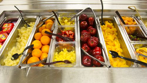 The fruit bar in the cafeteria at Talawanda High School, Thursday, Apr. 3, 2014. GREG LYNCH / STAFF When students were served healthier lunches, their test scores increased. according to a major study. (AJC File)