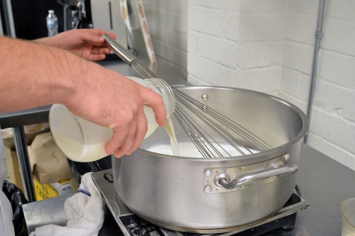 Pour 4 cups of milk into a thick-bottomed saucepan over low-medium heat