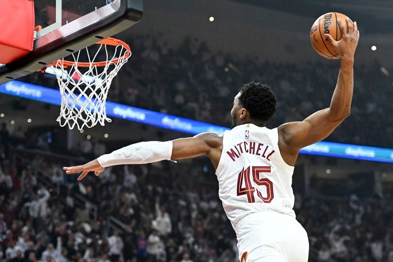 Cleveland Cavaliers' Donovan Mitchell dunks during the first half against the Orlando Magic in Game 1 of an NBA basketball first-round playoff series, Saturday, April 20, 2024, in Cleveland. (AP Photo/Nick Cammett)