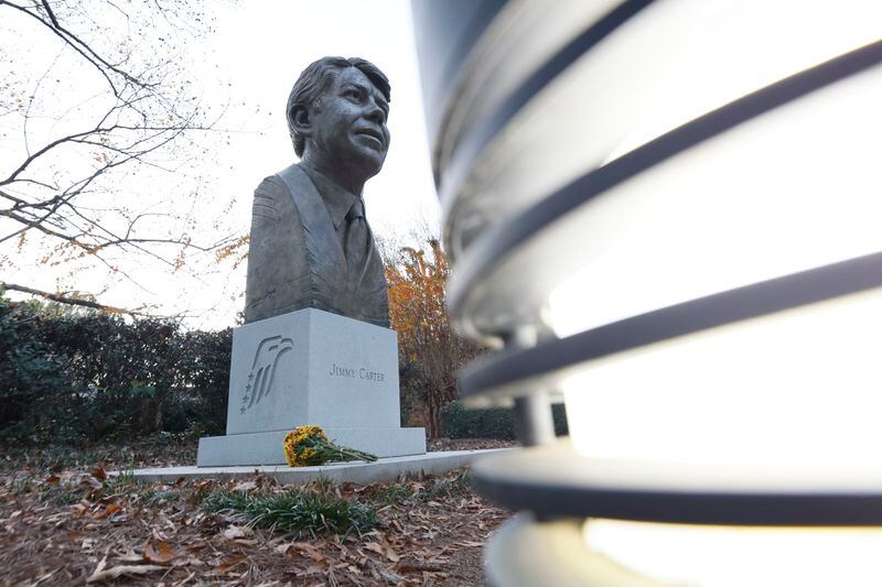 A bouquet is seen at the bust of Jimmy Carter outside of the Carter Center on Sunday, November 19, 2023, after the death of Rosalynn Carter, the wife of former president Jimmy Carter.
Miguel Martinez /miguel.martinezjimenez@ajc.com