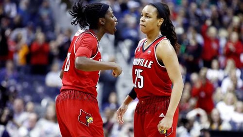 COLUMBUS, OH - MARCH 30:  Jazmine Jones #23 and Asia Durr #25 of the Louisville Cardinals celebrate the play against the Mississippi State Lady Bulldogs during the second half in the semifinals of the 2018 NCAA Women's Final Four at Nationwide Arena on March 30, 2018 in Columbus, Ohio.  (Photo by Andy Lyons/Getty Images)
