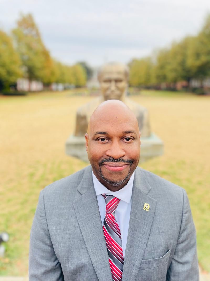 Joseph L. Jones, the director of the W.E.B. Du Bois Southern Center for Studies in Public Policy at Clark Atlanta University in front of a statue of the center's namesake.