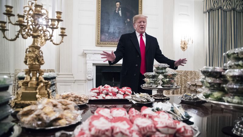 President Donald Trump gives remarks in front of the fast food that was served to the Clemson Tigers, the winners of the 2018 College Football Playoff National Championship, Jan. 14, 2019, at the White House in Washington.