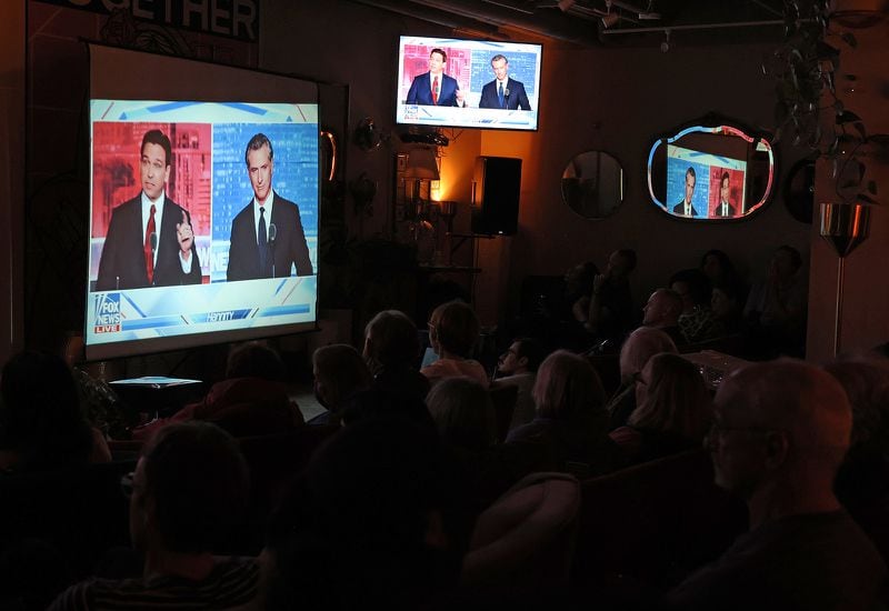 Wednesday's debate will be the second in as many weeks for Florida Republican Gov. Ron DeSantis, left on the screen, who faced off last week in Alpharetta against California Gov. Gavin Newsom, a Democrat who isn't running for president. (Justin Sullivan/Getty Images/TNS)