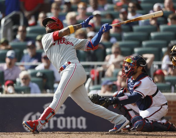 Philadelphia Phillies' Edmundo Sosa is out on a sacrifice fly that scored Jean Segura during the fifth inning of game one of the baseball playoff series between the Braves and the Phillies at Truist Park in Atlanta on Tuesday, October 11, 2022. (Jason Getz / Jason.Getz@ajc.com)