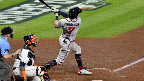 \Braves shortstop Dansby Swanson hits a two-run home run during the fifth inning against the Houston Astros in game 6 of the World Series at Minute Maid Park, Tuesday, November 2, 2021, in Houston, Tx. Hyosub Shin / Hyosub.Shin@ajc.com
