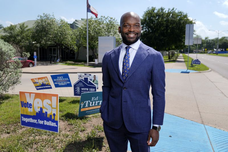 Abdul Dosunmu, the founder of the Young Black Lawyers Organizing Coalition, poses for a photo outside a voting location after he cast his ballot during early voting in Dallas, Monday, April 29, 2024. (AP Photo/Tony Gutierrez)