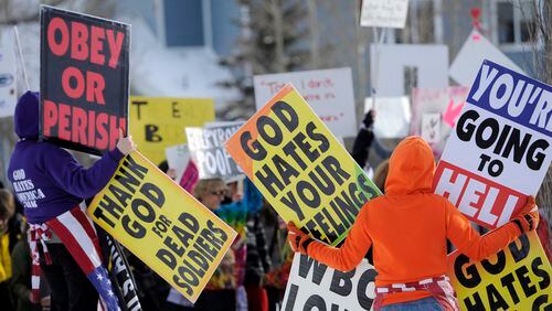Protestors from the Westboro Baptist Church hold up signs on Jan. 23, 2011 before the premiere of Kevin Smith's "Red State" at the Sundance Film Festival in Utah. Smith's new horror movie is inspired by the infamous Kansas church.
