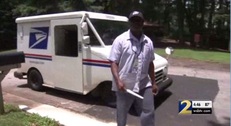 Postal worker Mark Palmer returns to the DeKalb County home where he saved the life of a 79-year-old woman who fell down her front steps.