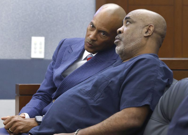 Duane “Keffe D” Davis, right, who is accused of orchestrating the 1996 slaying of hip-hop icon Tupac Shakur, right, listens to his attorney Carl Arnold during a status hearing at the Regional Justice Center, on Tuesday, April 23, 2024, in Las Vegas. (Bizuayehu Tesfaye/Las Vegas Review-Journal via AP)