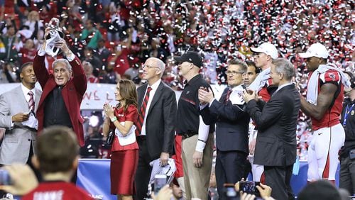 The Falcons are trying to get back to the Super Bowl after losing in the second round of the playoffs last season at Philadelphia. Here, owner Arthur Blank lifts the NFC championship trophy after a win over Green Bay two seasons ago