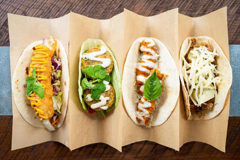 Tacos (from left to right)  Fish N' Chips, Falafel,  Spicy Tikka Chicken, and Cuban Pig. Photo credit- Mia Yakel.