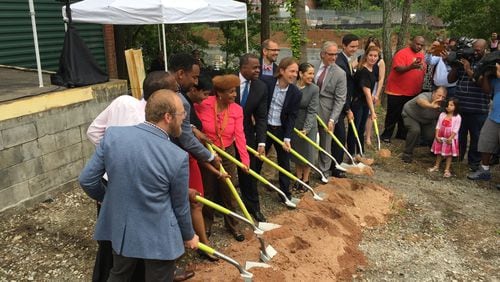 Atlanta Mayor Kasim Reed and City Councilwoman Cleta Winslow help break ground on manufacturing facility on Tuesday for Monday Night Brewing.