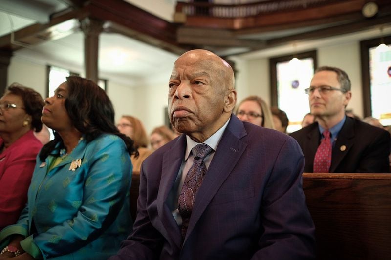 In a still from “John Lewis: Good Trouble,” the congressman sits in a Texas church before dancing. Afterward, he talked to a group of three sisters, as they shared stories of picking cotton. CONTRIBUTED BY MAGNOLIA PICTURES
