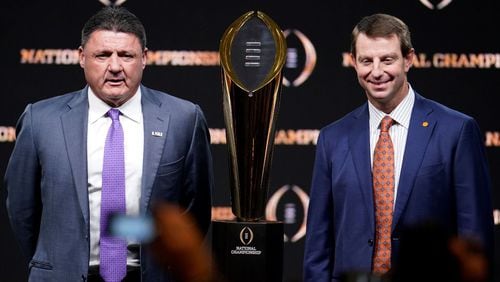 Ed Orgeron (left) and Dabo Swinney will lead LSU and Clemson into Monday's national championship game in New Orleans.
