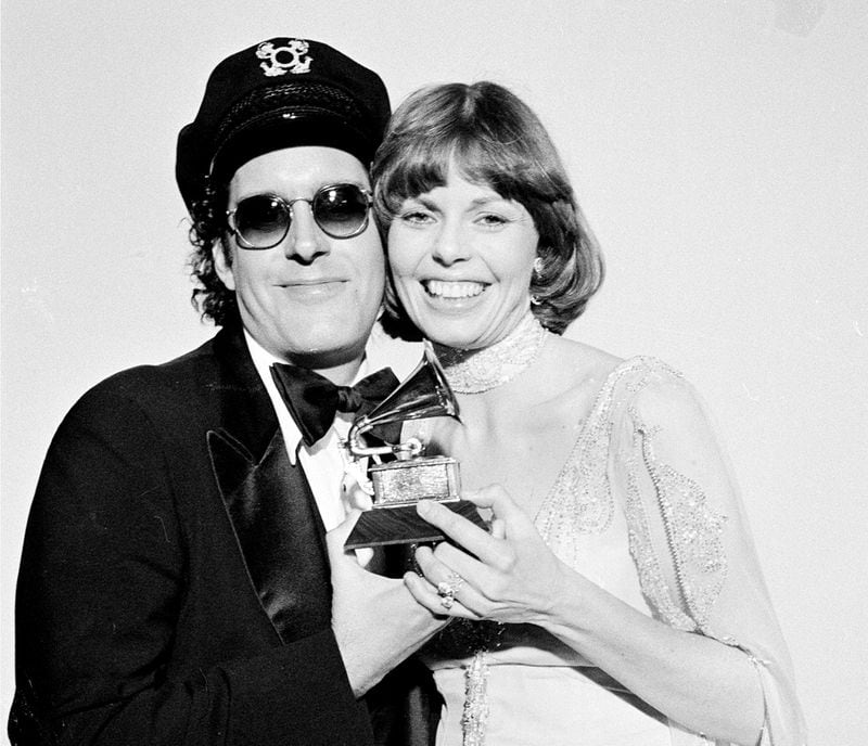 In this Feb. 28, 1976 file photo, Daryl Dragon and his wife Toni Tennille, of the Captain & Tennille, hold the Grammy award they won  for record of the year for "Love Will Keep Us Together," at the Grammy Awards ceremony in Los Angeles. (AP Photo, FIle)