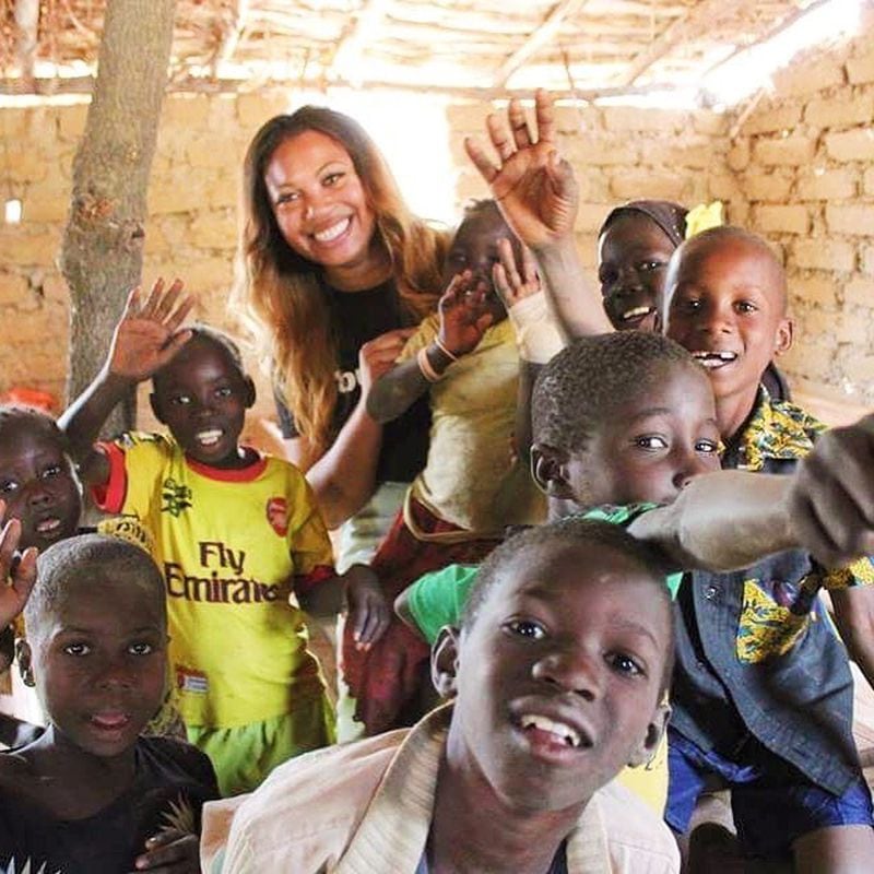 La’Nita Johnson bonded with the villagers in Morpougha, Burkina Faso, in 2016 when she was there to help build a school. (Courtesy of La’Nita Johnson)
