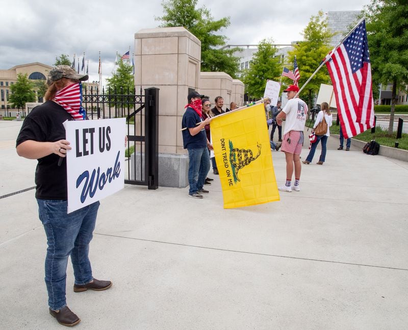 A group of people opposed to keeping Georgia businesses closed during the COVID pandemic protested outside the state Capitol on Friday, April 24, 2020. STEVE SCHAEFER / SPECIAL TO THE AJC