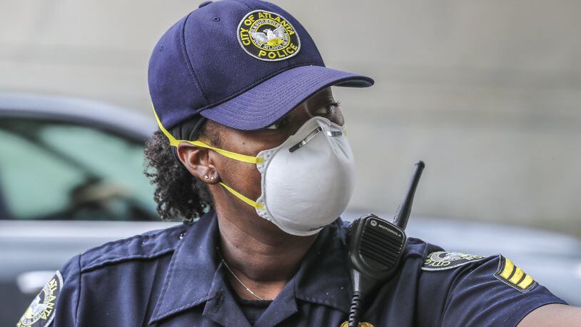 Atlanta Police Sgt. Dominique Simmons Friday, April 24, 2020, in downtown Atlanta. Coronavirus cases in Georgia continued to mount, as the state began easing restrictions on some businesses. JOHN SPINK/JSPINK@AJC.COM