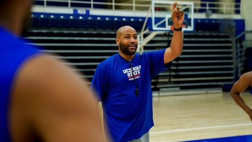 First-year Georgia State coach Jonas Hayes works with his players during summer workouts.