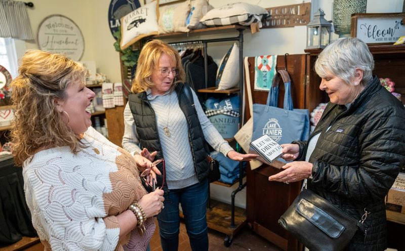 Shop owner Ginger Pigg (from left) shares a laugh with customers Lindsey Hansard and Geraldine Davies at The Perfect Pigg in Cumming. PHIL SKINNER FOR THE ATLANTA JOURNAL-CONSTITUTION.