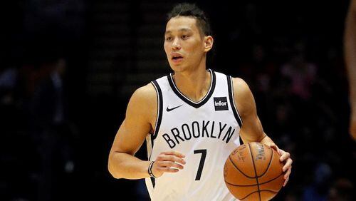 Jeremy Lin  of the Brooklyn Nets moves the ball during a preseason NBA basketball game against the Philadelphia 76ers on October 11, 2017.   (Photo by Paul Bereswill/Getty Images)