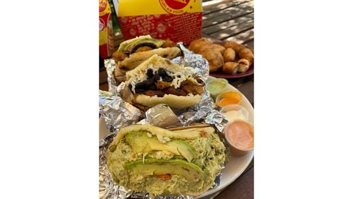 As the name indicates, Arepa Grill specializes in Venezuelan arepas, fried corn cakes slit and stuffed with all manner of proteins. 
Ligaya Figueras / ligaya.figueras@ajc.com