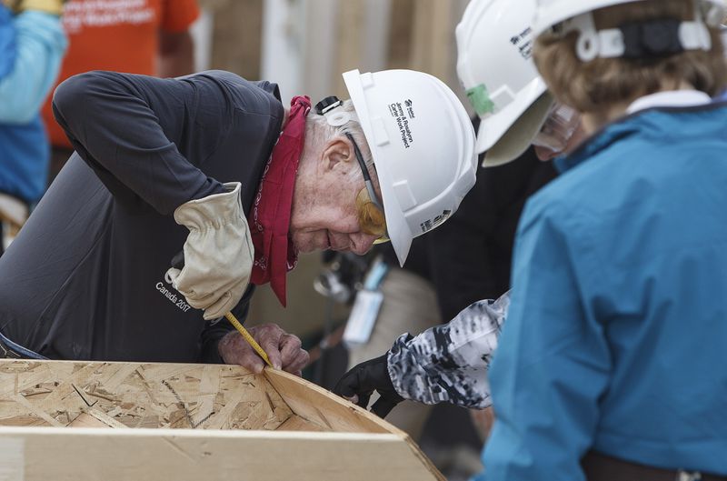 Former President Jimmy Carter helps build homes for Habitat for Humanity in Edmonton Alberta, Tuesday July 11, 2017. (Jason Franson/The Canadian Press via AP)