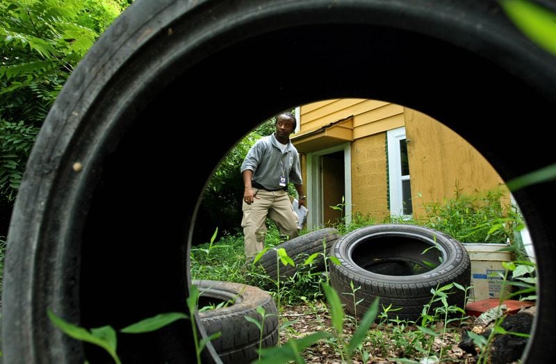 Abandoned tires create the perfect habitat for mosquitoes to breed. Removing any water-retaining objects from your property will reduce the areas available for the insect to lay eggs. AJC FILE PHOTO