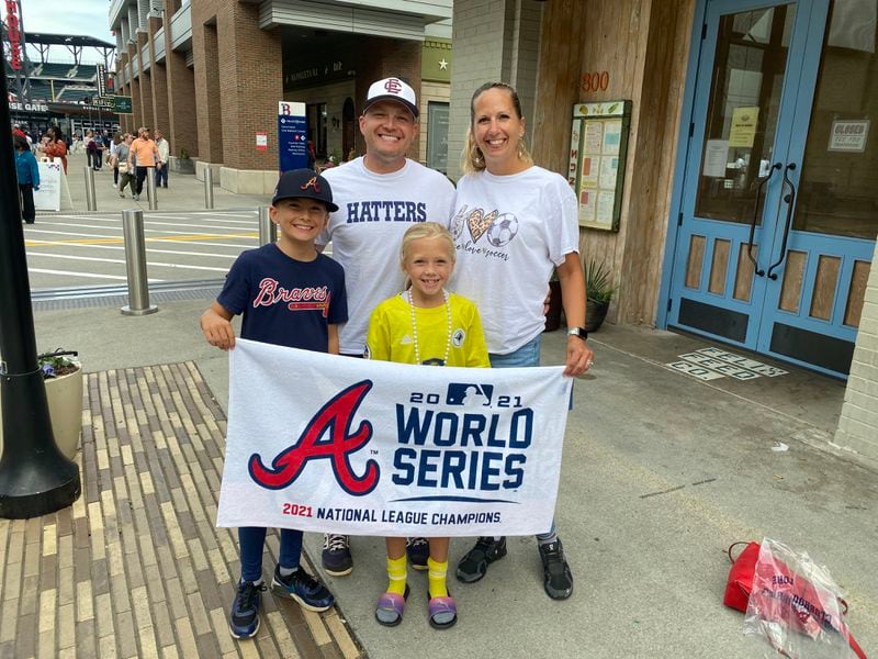 This Marietta family came out to Truist Park to purchase Atlanta Braves gear and celebrate the team's Advance to the World  Series. Pictured are parents, Mike and Krista with Trent, 10 and Aubrey, 8. 
The family's last name failed to get mentioned amid all the enthusiastic Braves talk with a reporter. Photo: Adrianne Murchison
