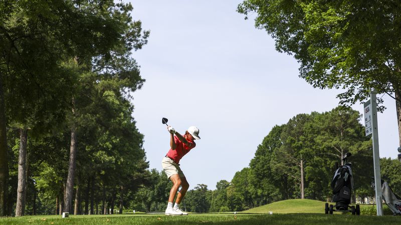 Carter Loflin hits his tee shot on the 10th hole during the semifinals at the 2022 U.S. Amateur Four-Ball at Country Club of Birmingham (West and East Courses) in Birmingham, Ala., on May 18. (James Gilbert/USGA)