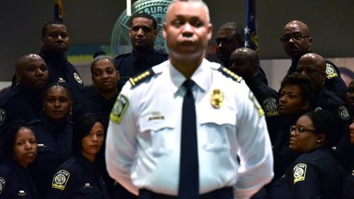 The Atlanta Public Schools Police Department Chief Ronald Applin, center, and the school district’s police officers are shown in this 2016 photograph taken during a swearing-in ceremony for officers. The school district’s police department was founded in 2016.  HYOSUB SHIN / HSHIN@AJC.COM