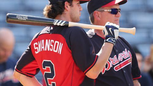 Dansby Swanson, here chatting with hitting coach Kevin Seitzer, entered the season-ending series against Detroit with a .300 average through his first 35 games, and the respect of his manager for doing things the right way (Curtis Compton/AJC file photo)