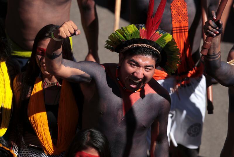 FILE - Indigenous people march during the 20th annual Free Land Indigenous Camp in Brasilia, Brazil, April 23, 2024. Thousands of Indigenous people continue to march on Thursday, April 25, calling on the government to officially recognize lands they have lived on for centuries and to protect territories from criminal activities like illegal mining. (AP Photo/Luis Nova, File)