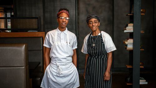 Ashleigh Shanti (left), with Hanan Shabazz, at Benne on Eagle in downtown Asheville, N.C. In the 1970s, Shabazz ran a restaurant on The Block, the African American community that once stood in the surrounding area; she now contributes to the menu. MIKE BELLEME / THE NEW YORK TIMES