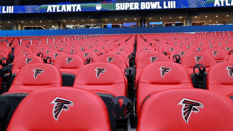 Some of the seats inside Mercedes-Benz Stadium still bear the Falcons logo while it is prepared for the Super Bowl on Tuesday, Jan. 22, 2019, in Atlanta.   Curtis Compton/ccompton@ajc.com
